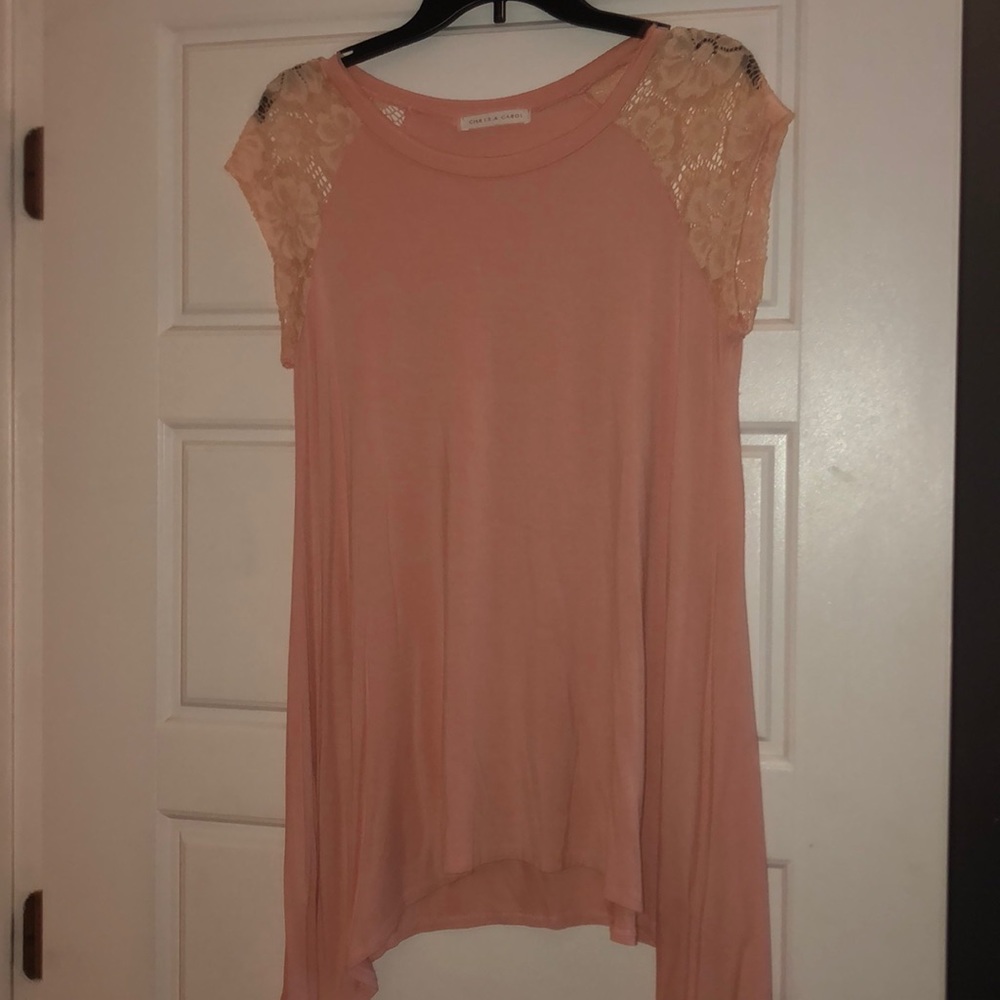 a stylish cute, lace shouldered, pink blouse